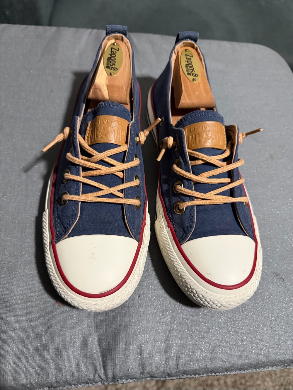 Converse Navy Canvas Low Top Sneakers with Tan Accents and Red Trim